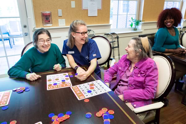 Residents enjoying a game of bingo with staff