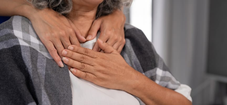 Close-up of a caregiver supporting a senior resident