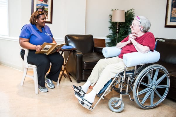 Staff member engaging with a resident in a common area
