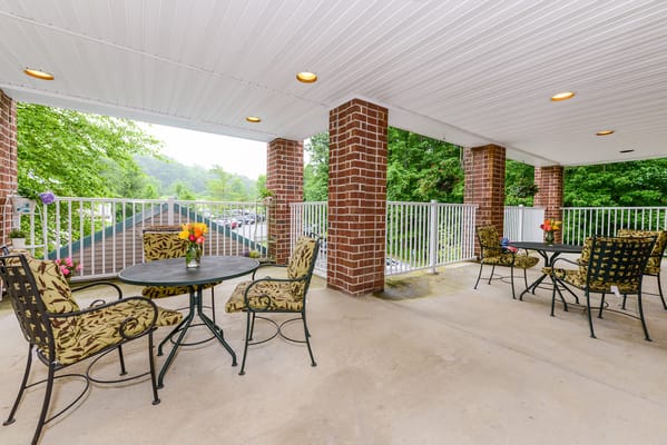 Outdoor seating area with tables and flowers