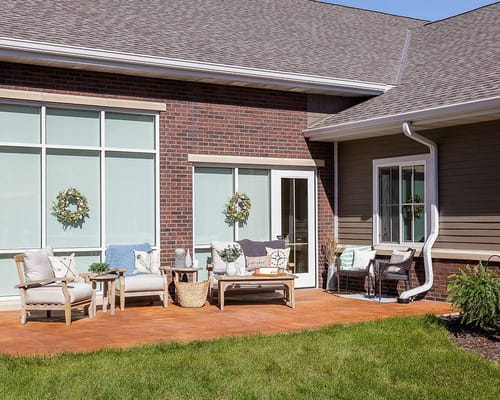 Outdoor seating area with comfortable furniture and decorations