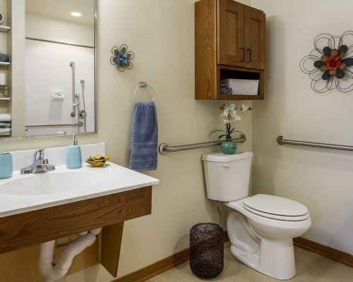 Clean, well-decorated bathroom in a resident's room