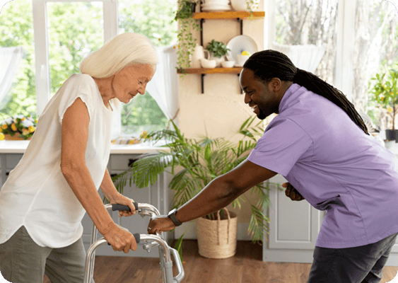 A caregiver assisting an elderly resident indoors