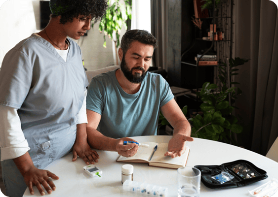 Healthcare professional assisting a resident with medication