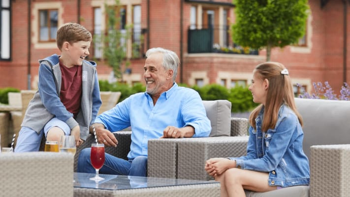 Grandfather enjoying time outside with grandchildren