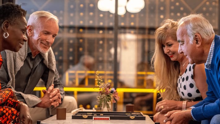 Residents enjoying a game together in a common area