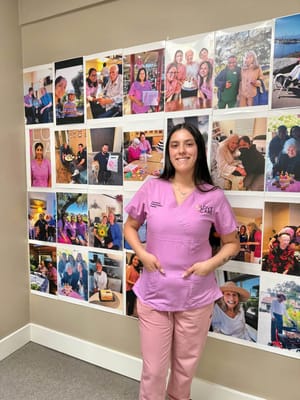 Staff member posing in front of a collage of resident activities