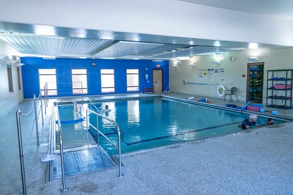 Indoor swimming pool area with residents