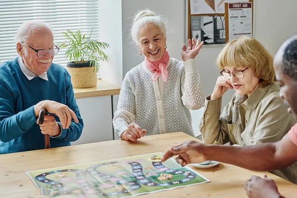 Residents enjoying a game in a communal activity room