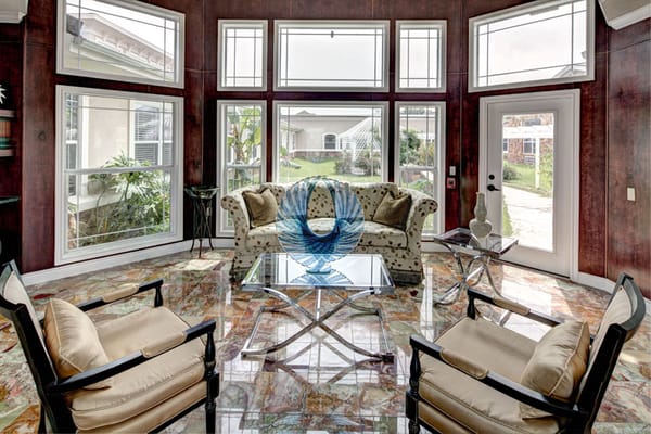 Bright common area with seating and large windows