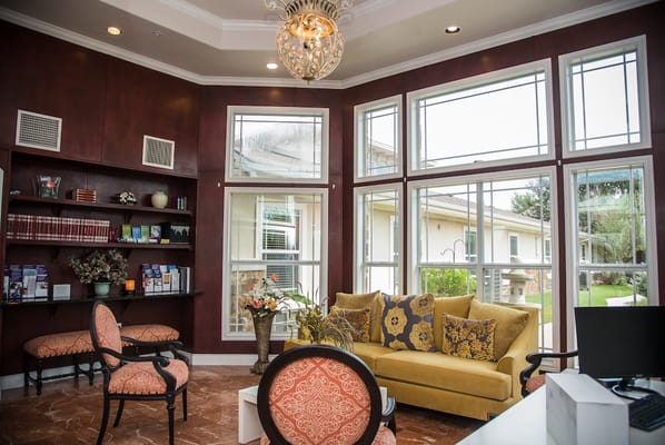 Bright and inviting common area with windows and seating