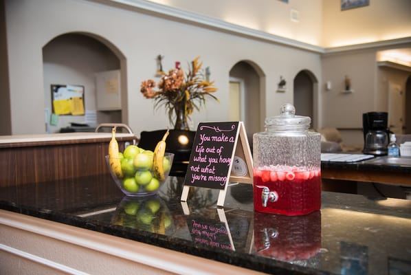 A cozy lobby area with refreshments and decor