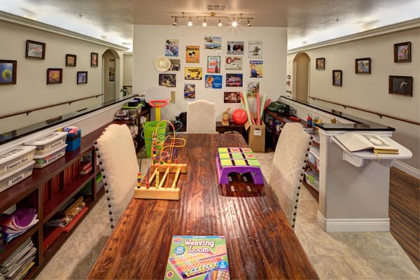 Activity room with crafting materials and games.