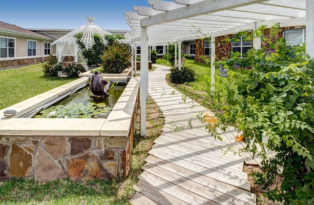 Serene outdoor garden path with water feature