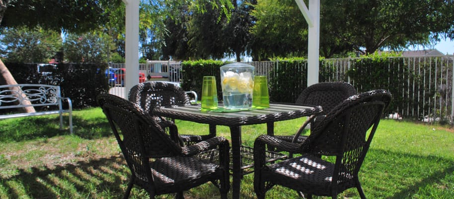 Outdoor seating area with a table and chairs
