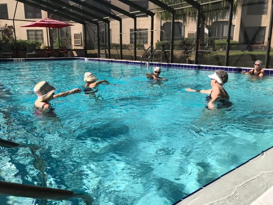 Residents enjoying swimming in the pool at the facility