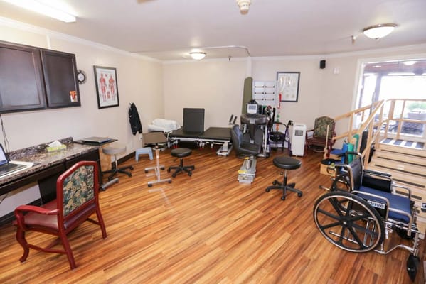 Interior therapy room with equipment and seating