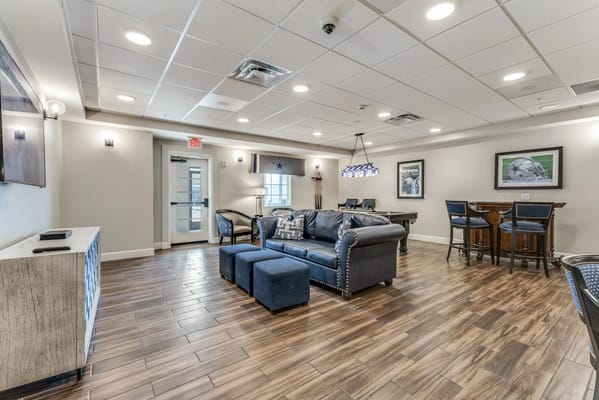 Common lounge area with seating and tables