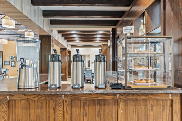 Coffee and pastries displayed in a dining area