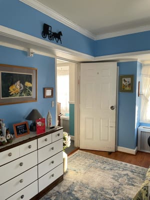 Well-decorated private room with blue walls