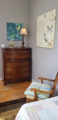 Cozy resident room with antique furniture and artwork
