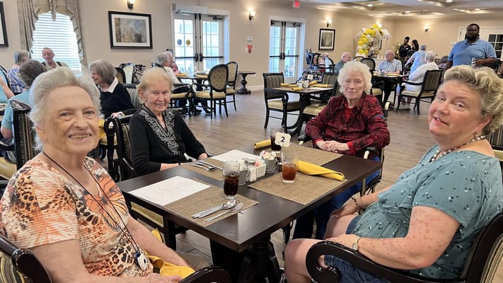Residents enjoying a meal in the dining room