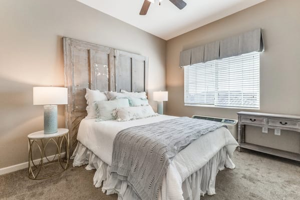 Stylish bedroom with soft bedding and natural light