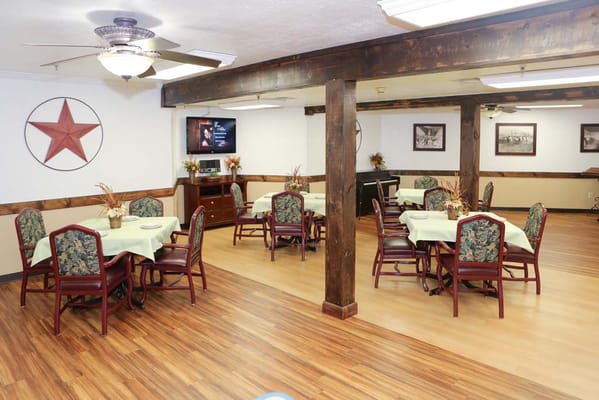 Dining area with tables and chairs in a common space