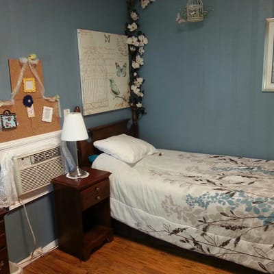 Cozy resident bedroom in a soothing blue color scheme