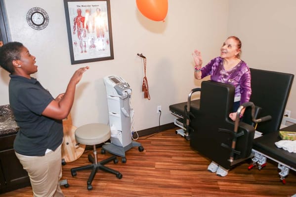 Residents and staff engaging in an activity indoors