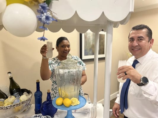 Staff serving drinks at a celebration event