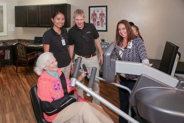 Residents engaging in exercise with staff support