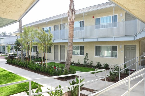 Exterior view of a senior living facility with landscaping