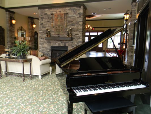 Interior view of a common area with a piano
