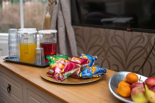 Snacks and beverages on a tray in a facility common area