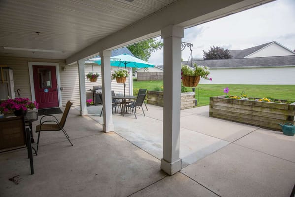 Outdoor seating area with flowers and tables