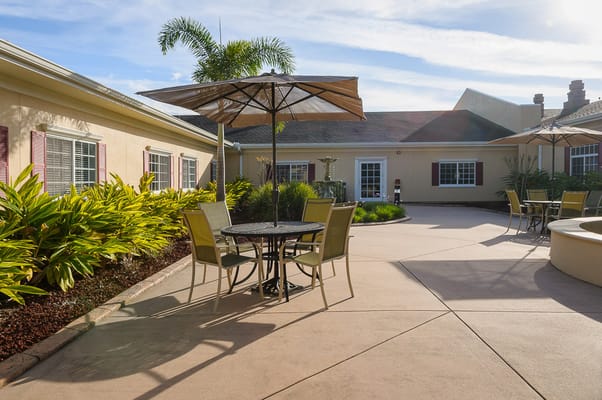 Outdoor seating area with tables and umbrellas