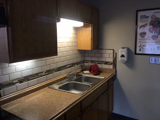 Kitchen area with sink and countertop