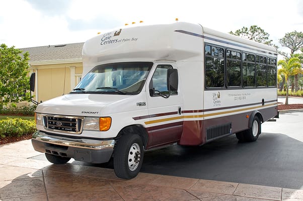 Facility shuttle bus parked outside the center