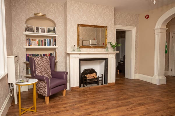 Cozy common area with bookshelves and seating