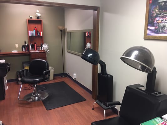 Interior view of a hair salon with styling chairs