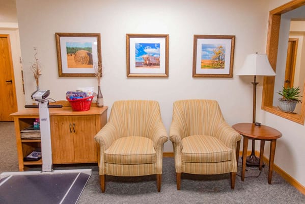 Cozy common area with chairs and artwork