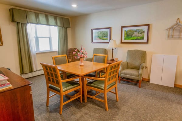 Cozy common area with dining table and chairs