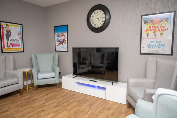 Common area with comfortable seating and a television