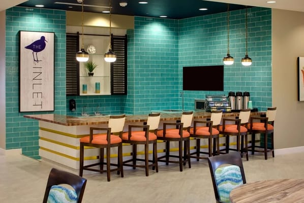 Bright and modern common area with bar seating