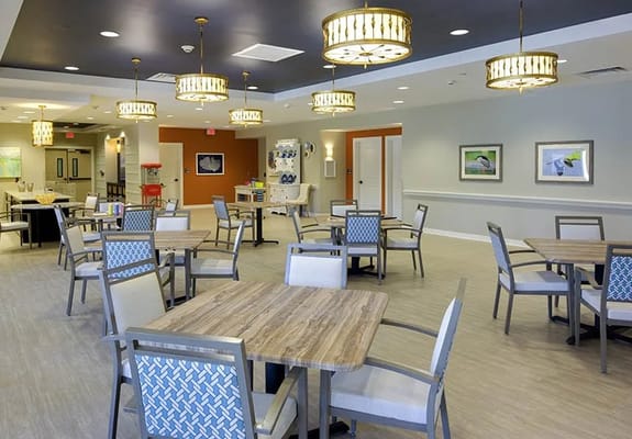 Bright common area with tables and chairs