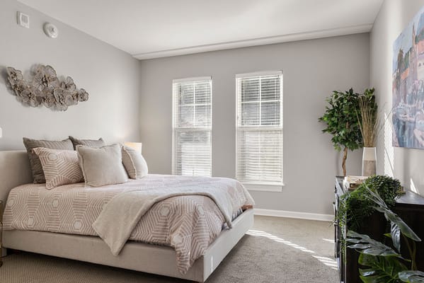 Bright and inviting private resident room with bed and decor