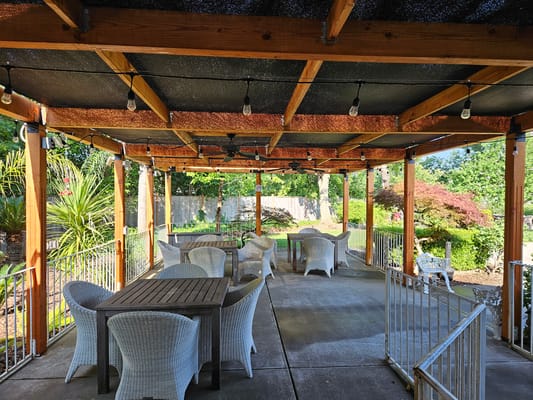 Outdoor seating area with tables and chairs