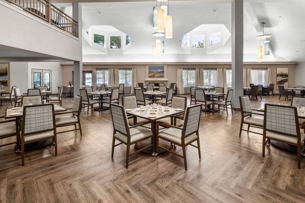 Bright dining area with tables and chairs
