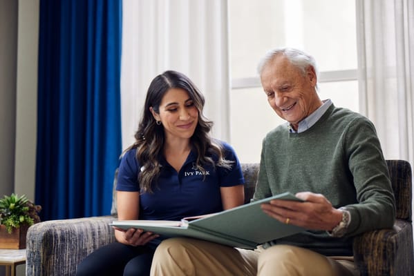 Caregiver engaging with a resident in a cozy setting